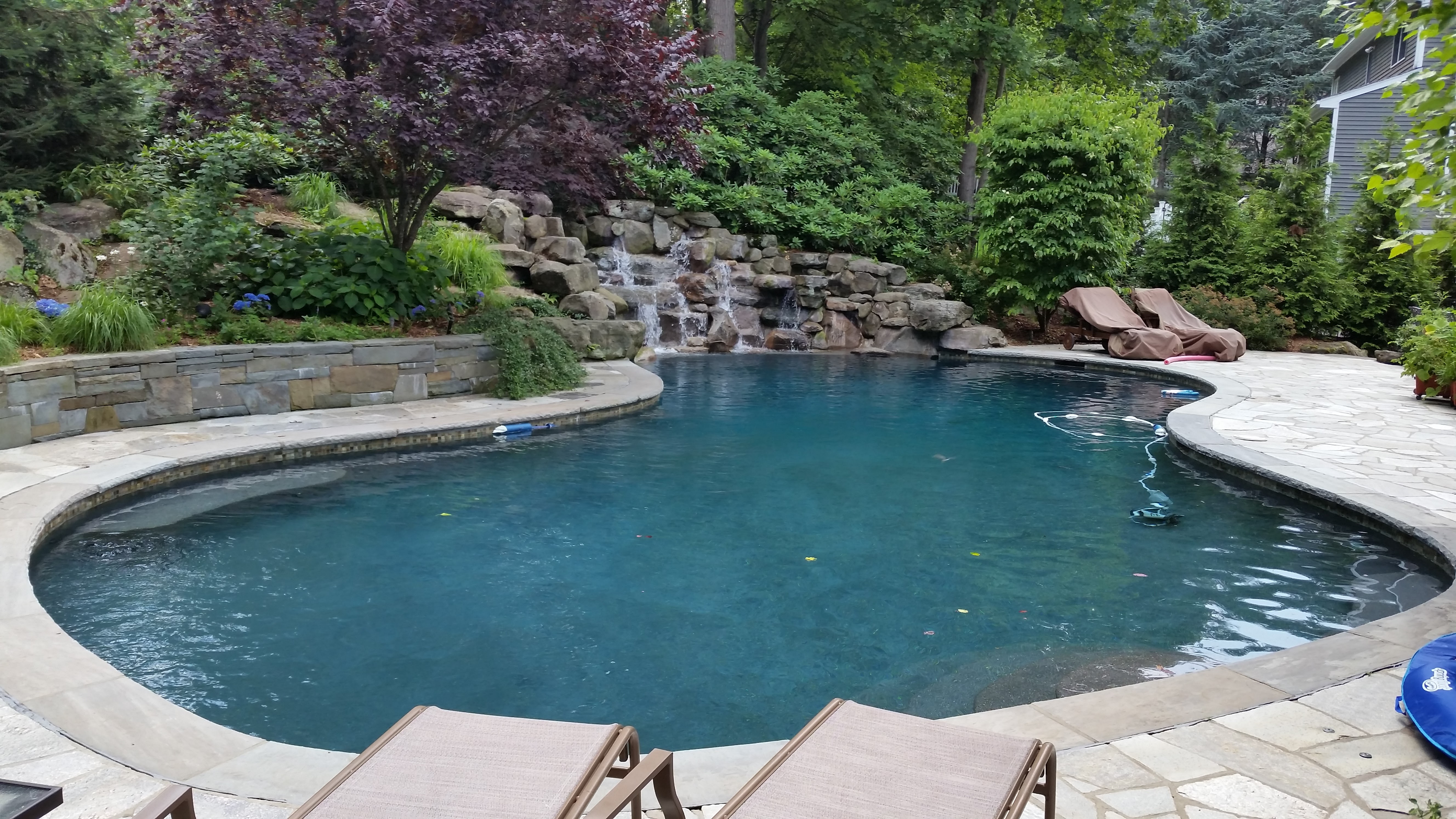 Stone patio around pool